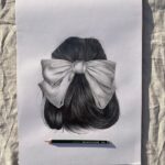 Detailed pencil drawing of a hair bow on textured paper, showcasing artistic skill.